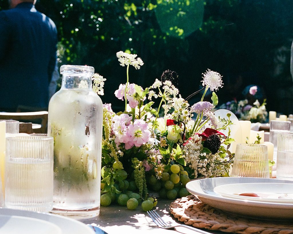 A wedding reception table set in the garden at The Craft House Inn