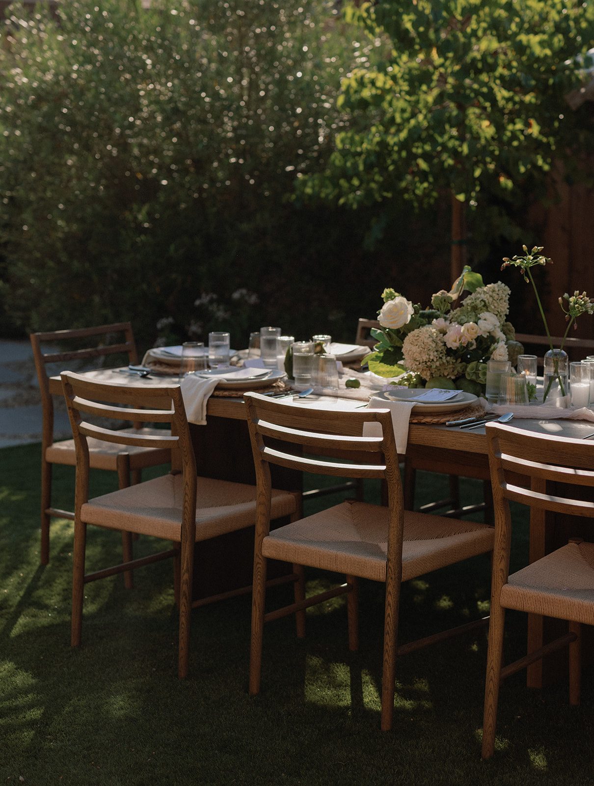 The private garden set for a long-table dinner