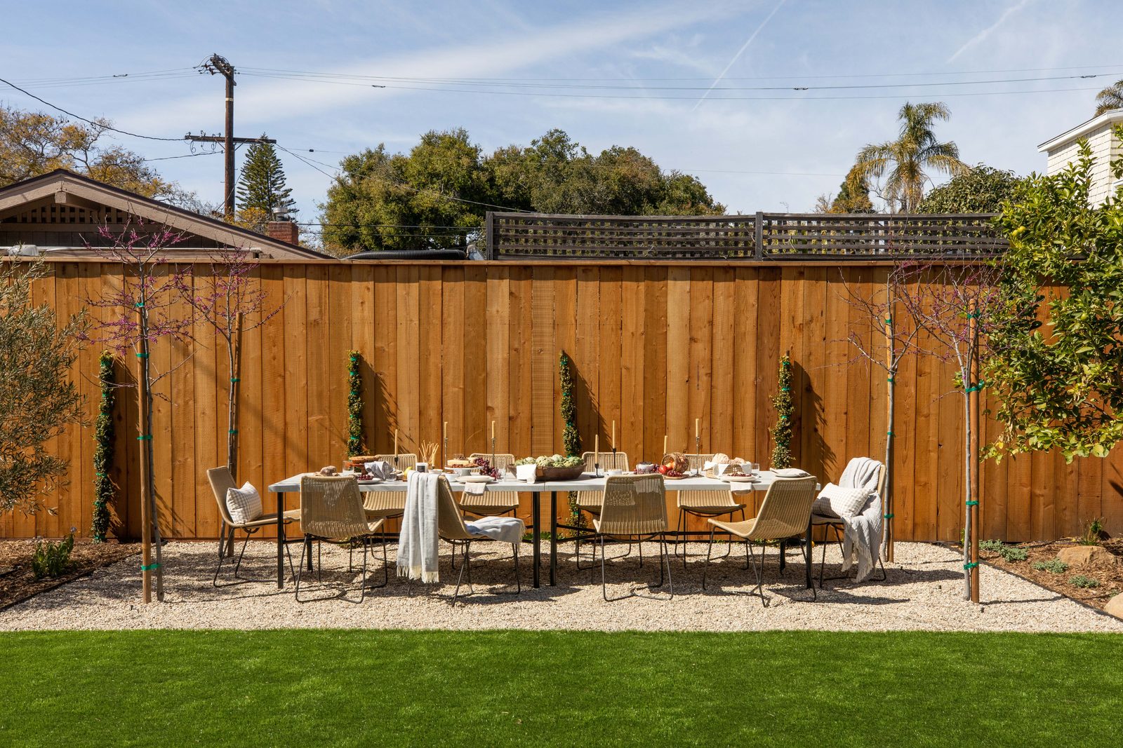 A long table set for dinner in the garden