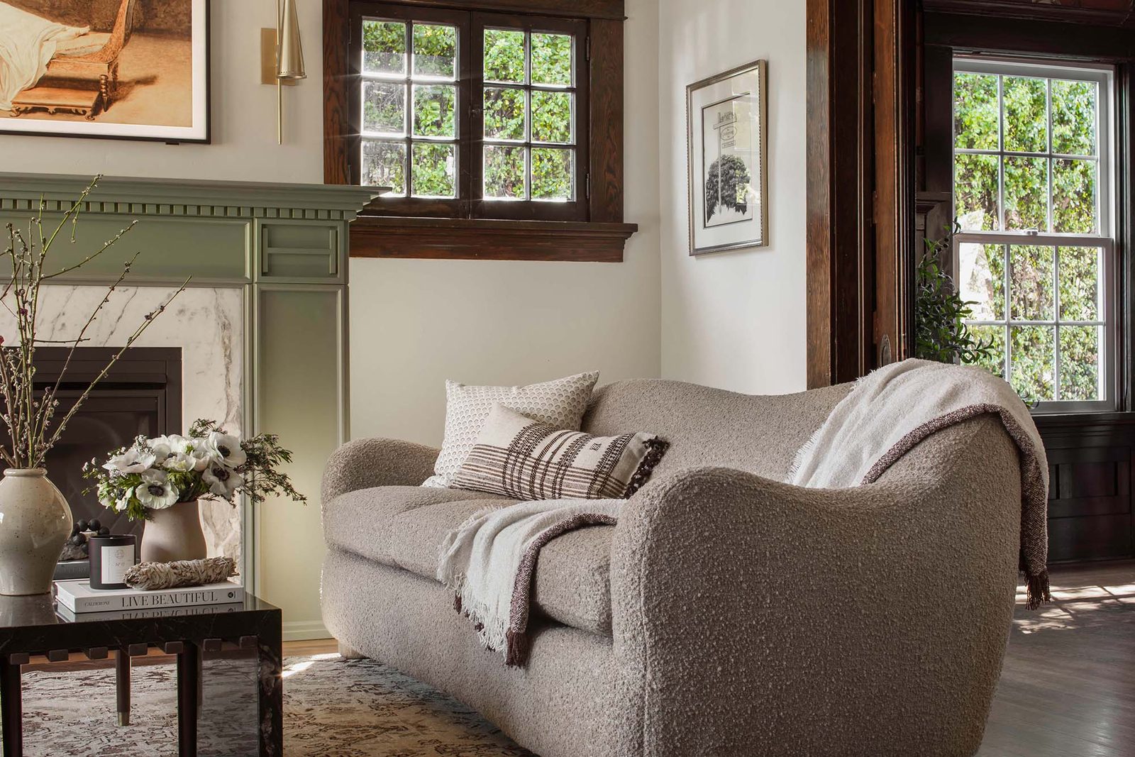 A boucle sofa by the window in the living room
